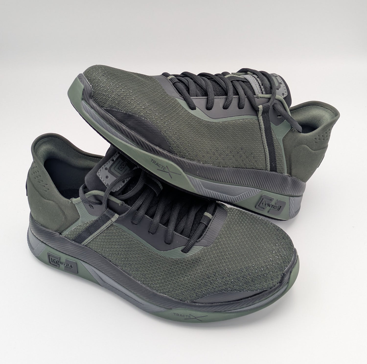 Pair of green athletic shoes on a white background
