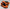 Orange and black athletic shoes on a light gray background