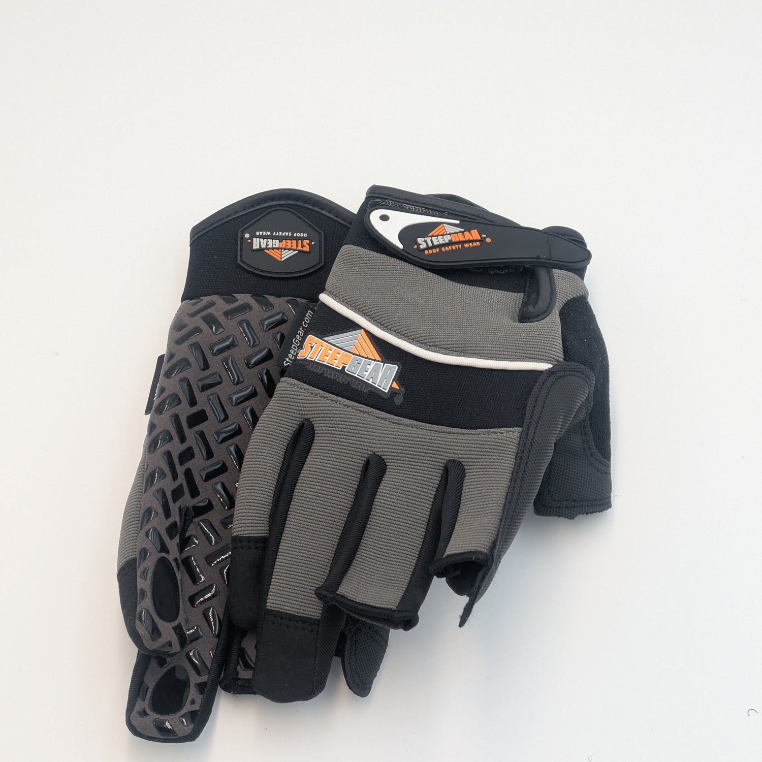 Pair of black and gray gloves with textured palm on a white background